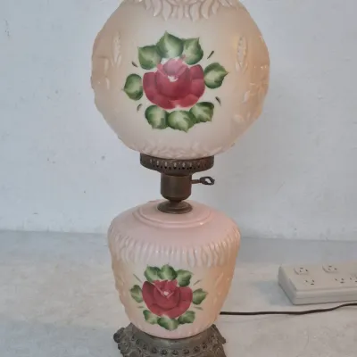 Sale Photo Thumbnail #9: Vintage Gone with the Wind style electric table lamp, featuring hand-painted red roses on a blush pink molded glass globe and base.