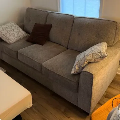 Contemporary Gray Textured Upholstered Three-Seat Sofa with Decorative Accent Pillows