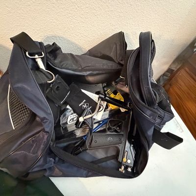 Sale Photo Thumbnail #102: Navy blue sports duffel bag filled with paintball equipment and accessories, including a black marker.