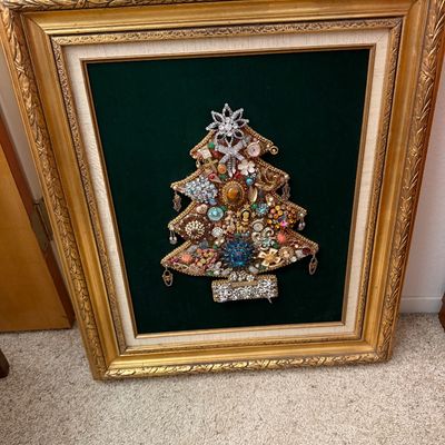 Sale Photo Thumbnail #110: Framed vintage costume jewelry Christmas tree art piece mounted on green velvet, housed in a ornate gilded wooden frame.