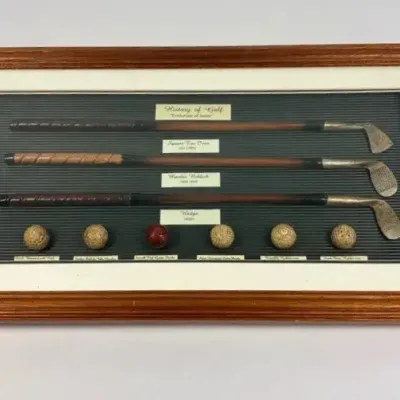 History of Golf – Evolution of Irons & Golf Balls Framed Shadowbox Display  Description: Deco