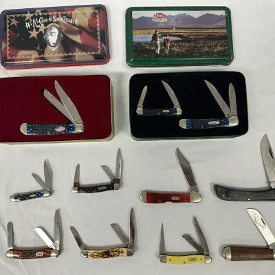 Collection of Case XX pocket knives, including commemorative tin sets and various multi-blade folding models with bone, synthetic, and...
