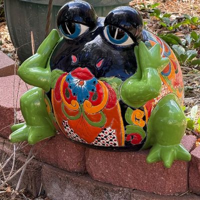 Large colorful Talavera ceramic frog garden statue featuring hand-painted floral motifs and a glossy glazed finish.