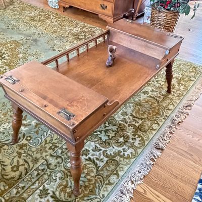 Vintage Colonial Revival maple cobbler's bench style coffee table with hinged side storage compartments, spindle gallery rail, and...