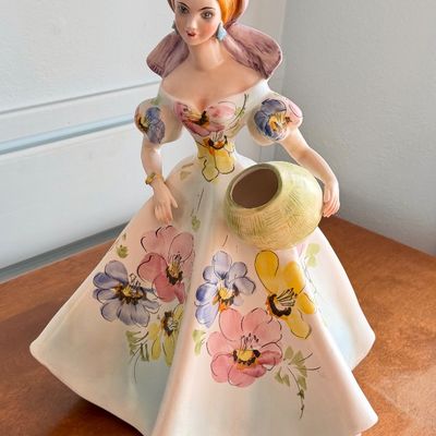 Vintage mid-century ceramic Southern Belle lady head vase depicting a woman in a floral gown holding a basket.
