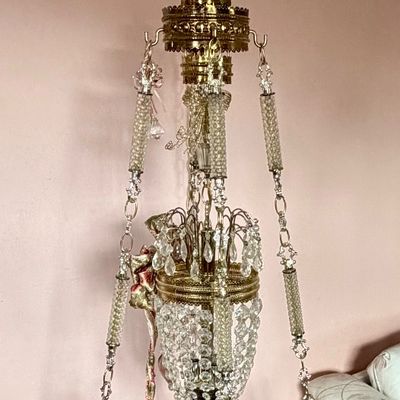 Vintage Hollywood Regency hanging swag table, featuring a brass-trimmed faux-marble round tray platform suspended from a crystal-beaded...