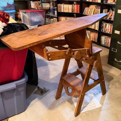 Vintage convertible wooden ironing board step stool, featuring a fold-out board mechanism and a heart cutout detail on the lower step.