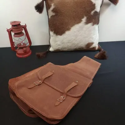 Cowhide Pillow, Top Grain Saddle Bag, And Decorative Lantern