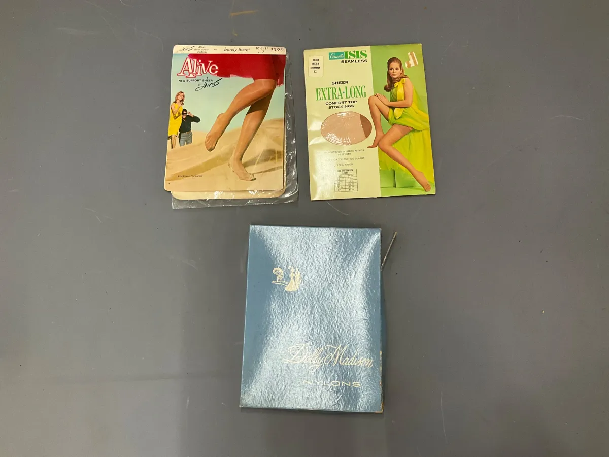 Sale Photo Thumbnail #325: Vintage hosiery collection, including two sealed packages of Alive and Grants Isis stockings alongside a blue Dolly Madison Nylons box.