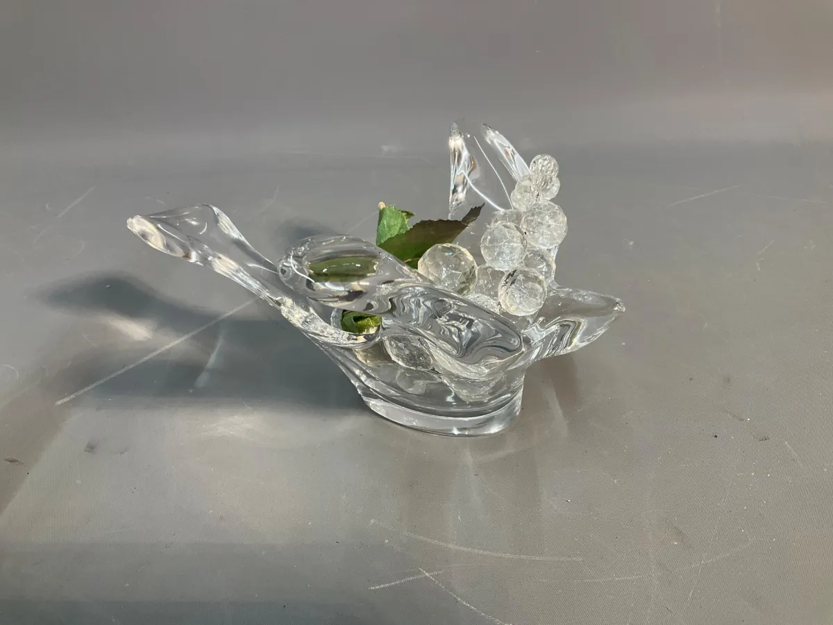 Sale Photo Thumbnail #60: Vintage clear art glass bird figurine dish containing decorative crackle glass grape clusters with artificial green leaves.