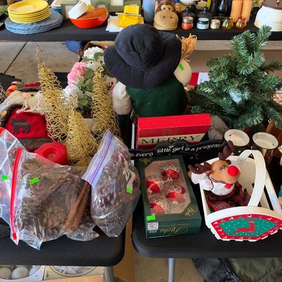 Sale Photo Thumbnail #122: Assortment of holiday and Christmas decorations, including miniature trees, Santa figurines, glass ornaments, bags of pinecones, and novelty tabletop items.