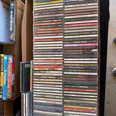 Sale Photo Thumbnail #171: Large collection of 1990s and 2000s music CDs organized in cardboard boxes, featuring popular pop, rock, and country artists.