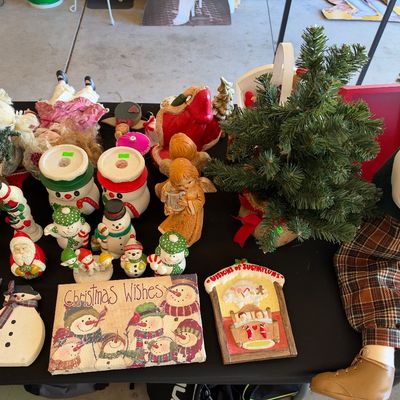 Sale Photo Thumbnail #128: Collection of vintage Christmas decorations, including snowman figurines, angel statues, small tabletop artificial trees, wall plaques, and plush holiday figures.