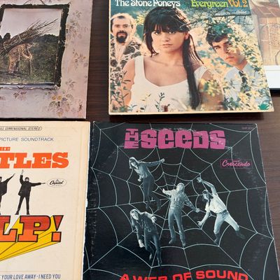 Collection of vintage vinyl record albums including Led Zeppelin IV, The Stone Poneys Evergreen Vol. 2, The Beatles Help! soundtrack, and...