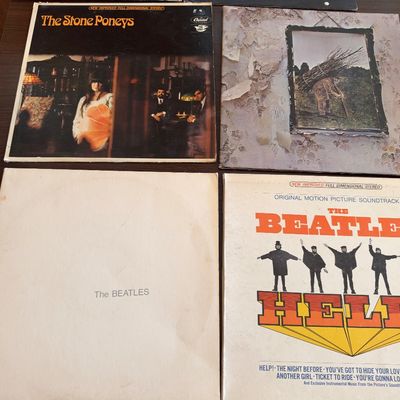 Collection of vintage vinyl record albums, including Led Zeppelin IV, The Beatles' White Album, The Beatles' Help! soundtrack,...