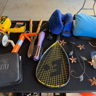 Sale Photo Thumbnail #135: Assorted household items, including a Wagner paint sprayer, caulk gun, hedge shears, racquetball racquet, travel pillows, and decorative metal wall art.