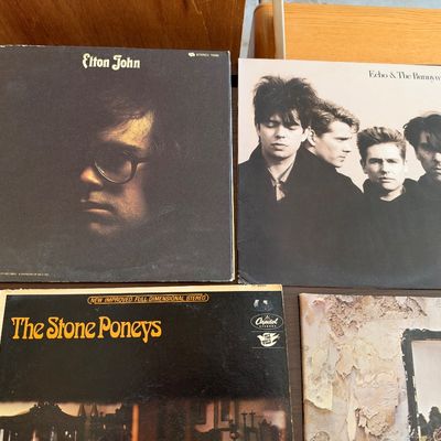 Collection of classic rock and post-punk vinyl LP albums, including Elton John, Echo & The Bunnymen, The Stone Poneys, and Led...