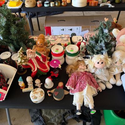 Sale Photo Thumbnail #123: Collection of vintage holiday decor, plush dolls, porcelain figurines, and miniature Christmas trees displayed on a table.