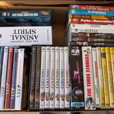 Sale Photo Thumbnail #169: Cardboard box packed with various DVD and Blu-ray television series and movie sets, including Columbo, Veep, and It's Always Sunny in Philadelphia.