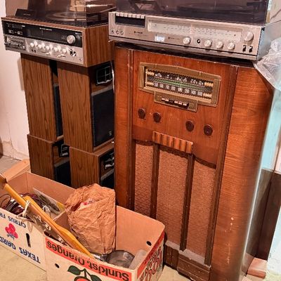 Vintage audio equipment collection including a 1940s floor-standing console radio and two stereo receivers with integrated turntables,...