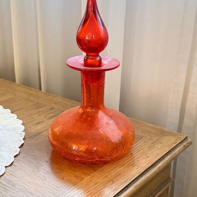 Vintage Blenko style orange crackle glass decanter with a tall flame-shaped stopper.