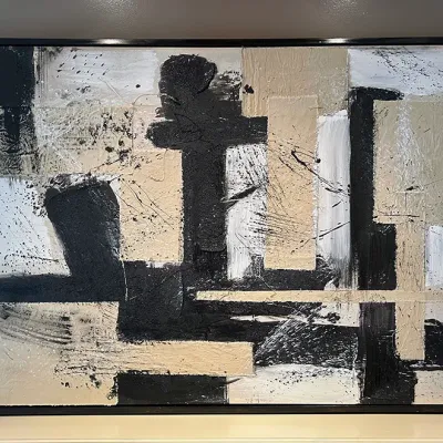 Sale Photo Thumbnail #81: Large contemporary abstract mixed-media canvas painting featuring textured impasto brushstrokes in black, beige, and white tones, set in a slim black frame.