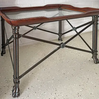 Sale Photo Thumbnail #273: Neoclassical style metal coffee table featuring a removable brown leather glass-top tray and X-frame cross braces.