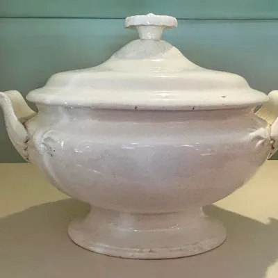 Sale Photo Thumbnail #105: Antique white ironstone covered tureen with scroll handles and a matching lid.