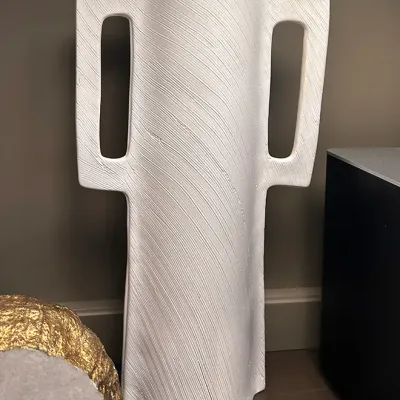 Sale Photo Thumbnail #69: Contemporary tall white ceramic vase with large cutout handles and a textured combed finish.