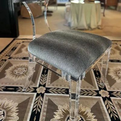 Sale Photo Thumbnail #124: Modern acrylic side chair featuring a curved Lucite frame and dark metallic textured shagreen-style upholstery.