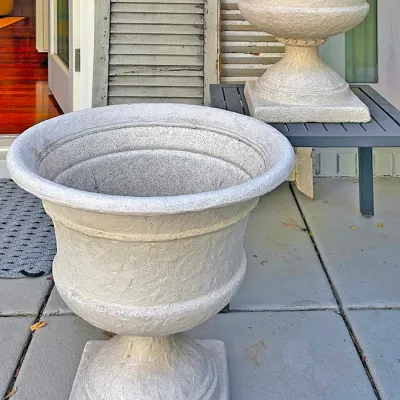 Sale Photo Thumbnail #242: Pair of large classical-style cast stone or composite urn planters with pedestal bases.