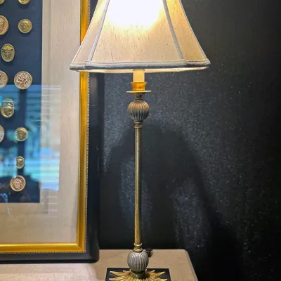 Sale Photo Thumbnail #7: Traditional brass buffet lamp featuring fluted accents, a leaf motif on a dark base, and a fabric lampshade.