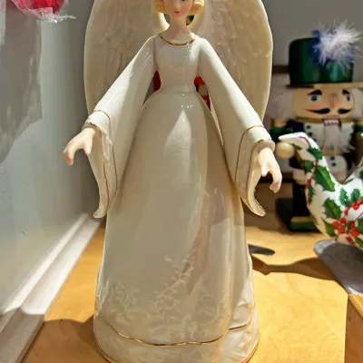 Sale Photo Thumbnail #93: Lenox porcelain standing angel figurine featuring iridescent white glaze and gold trim accents.