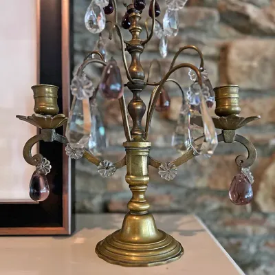 Sale Photo Thumbnail #117: Vintage brass two-light candelabra decorated with clear and amethyst-tinted crystal prisms and teardrop drops.