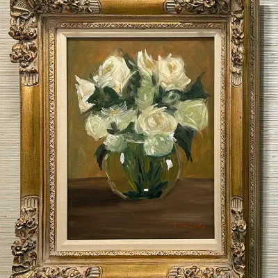 Sale Photo Thumbnail #190: Framed still life oil painting depicting white roses in a glass vase, signed in the lower right and set in an ornate gilded baroque-style frame.