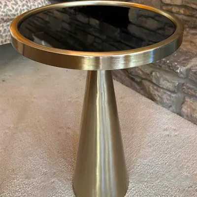 Sale Photo Thumbnail #133: Contemporary round pedestal side table featuring a brushed brass conical base and a dark glass top.