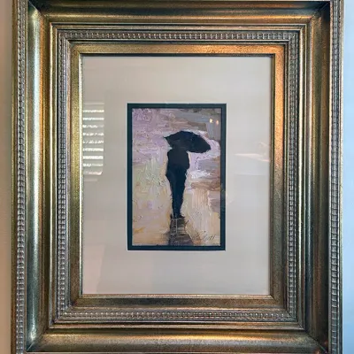 Sale Photo Thumbnail #196: Framed impressionist oil painting depicting a figure with a black umbrella, signed in the bottom right, housed in an ornate metallic gold-tone frame.