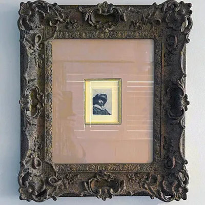 Sale Photo Thumbnail #202: Framed miniature portrait print featuring a Rembrandt self-portrait etching style, housed in a double-matted ornate Baroque-style gilded frame.