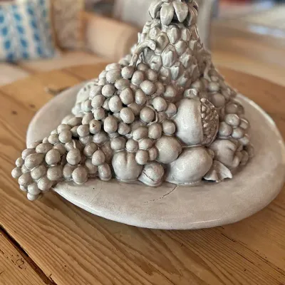Sale Photo Thumbnail #118: Vintage Italian white glazed ceramic fruit topiary centerpiece, featuring stacked grapes, lemons, and pomegranates on a matching charger.