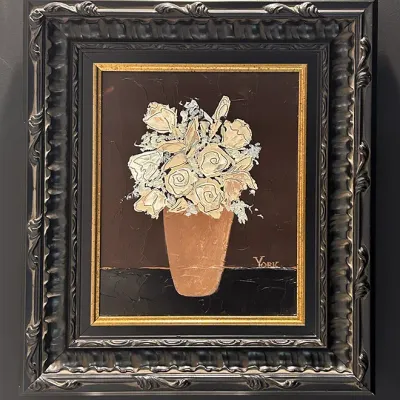 Sale Photo Thumbnail #176: Original impasto oil painting depicting white roses in a vase signed York, housed in a heavily ornate black and silver carved frame.