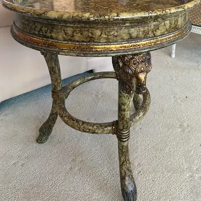 Sale Photo Thumbnail #111: Neoclassical style accent table featuring faux-marble painted finish, gilt lion head mounts, and animal hoof feet.