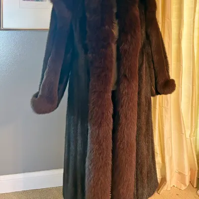Sale Photo Thumbnail #164: Vintage dark brown mink coat with a voluminous fox fur shawl collar and oversized cuffs, displayed on a dress form.
