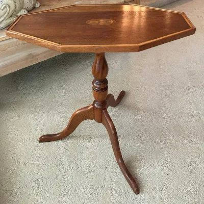 Sale Photo Thumbnail #123: Vintage octagonal wood tilt-top accent table featuring a central urn marquetry inlay, turned pedestal, and tripod legs.