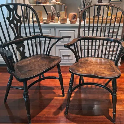 Sale Photo Thumbnail #59: Pair of antique dark-stained wooden armchairs, including a Windsor comb-back style and a pierced splat-back design with saddle seats.