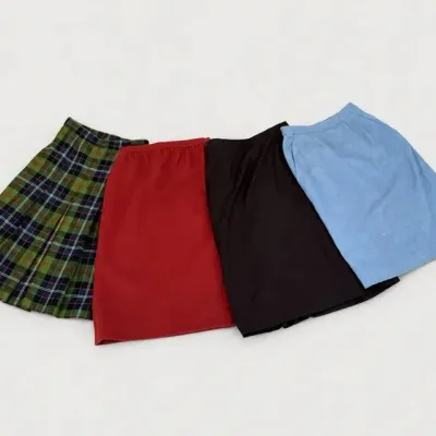 Sale Photo Thumbnail #32: Collection of four women's vintage A-line skirts, including one green tartan plaid pleated style and three solid-color skirts in red, black, and light blue.