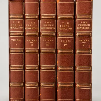 Sale Photo Thumbnail #3: Five-volume leather-bound book set of "The French Revolution" by Adolphe Thiers, published in London, 1838, featuring gilt-embossed spines with minor wear to the caps.