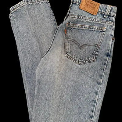 Sale Photo Thumbnail #31: Vintage Levi's 505 orange tab light wash denim jeans, size W29 L32, featuring a high-waisted, straight-leg silhouette in good pre-owned condition.