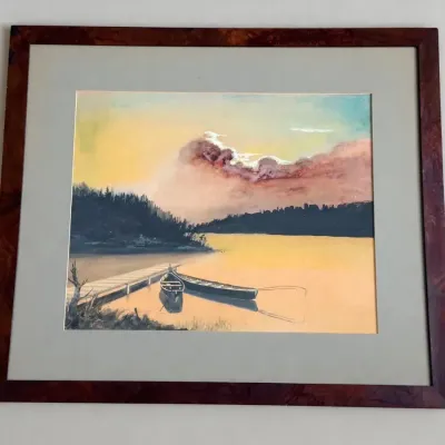 Sale Photo Thumbnail #54: Framed landscape painting depicting canoes docked by a wooden pier at sunset, housed in a burl wood style frame with matting.