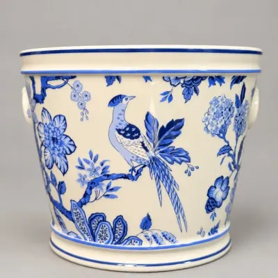 Sale Photo Thumbnail #73: Blue and white porcelain cachepot featuring a chinoiserie motif of a bird perched on floral branches.