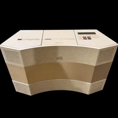 Sale Photo Thumbnail #12: Vintage Bose Acoustic Wave Music System model AW-1 in off-white plastic casing, featuring top-loading controls and built-in speakers, circa late 1980s to 1990s.